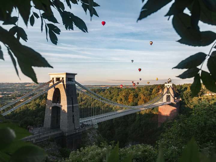 Hot air balloons flying over bridge in Bristol